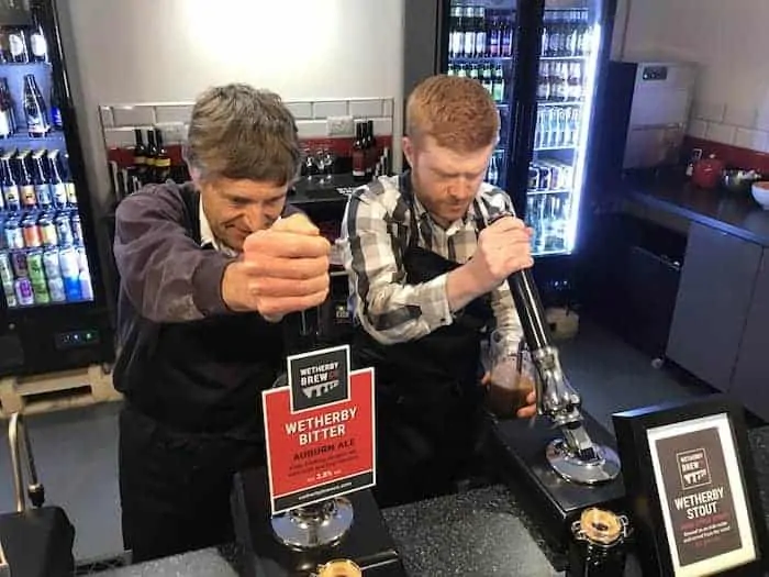 Wetherby Brew Co brewing experience guests pulling a pint